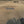 Photo of a Mobi-Heli Portable helipad that has been rolled out on dirt in a rural area.The photo has been taken from a flying helicopter
