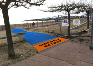 Photograph of a blue Mobi - Path / Roadway that  is being used  a temporary footpath at a building / construction area to keep people safe and out of dangers way.